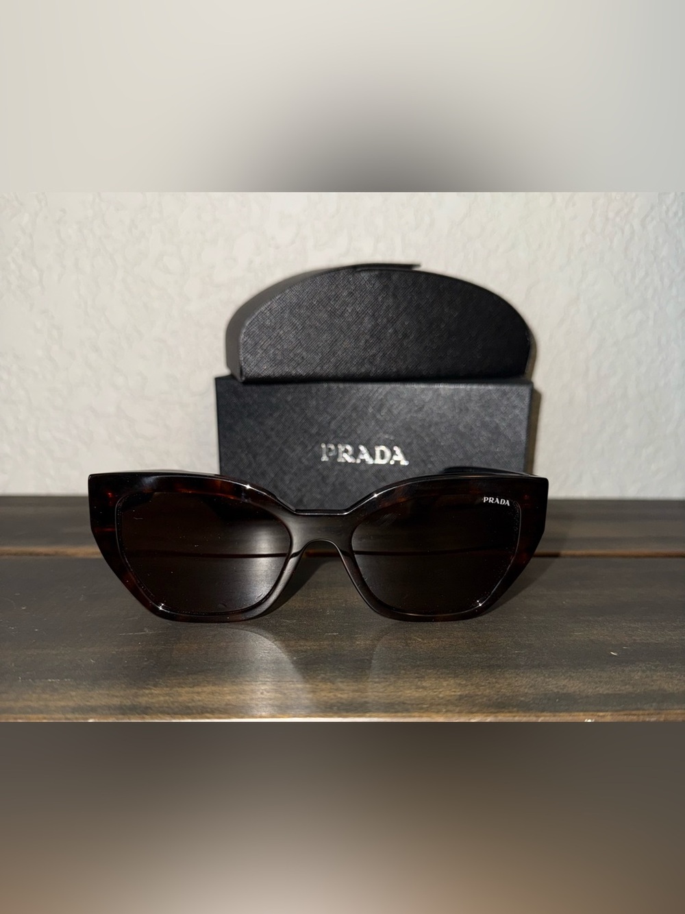Prada Women's Tortoise Shell Sunglasses with Dark Lenses